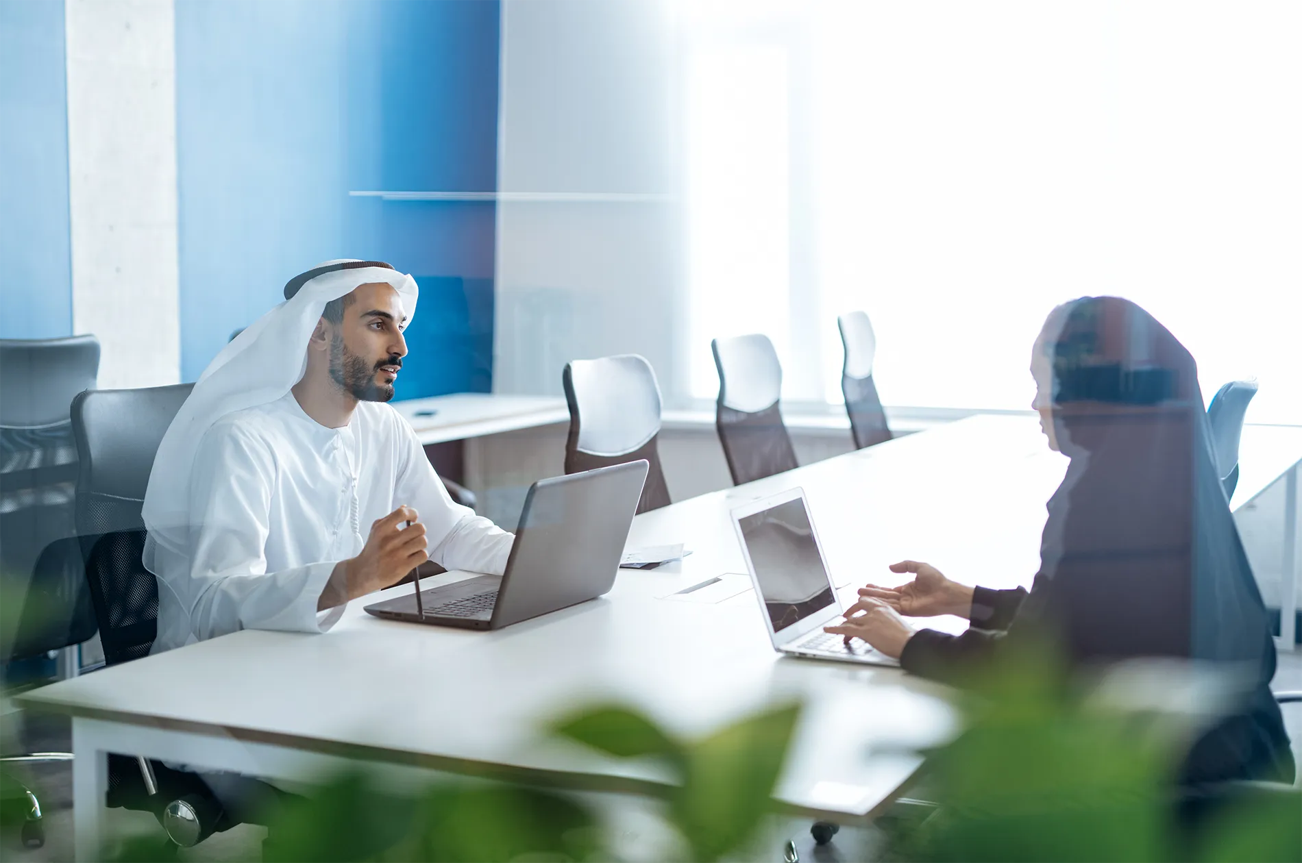 rear-view-woman-using-laptop-office